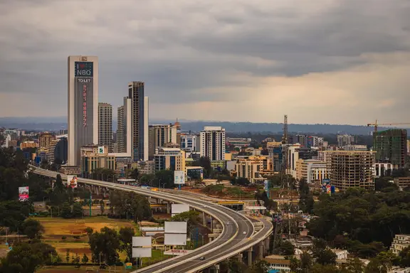 Nairobi central business district skyline and expressway — Pezari advises across Kenya's major markets