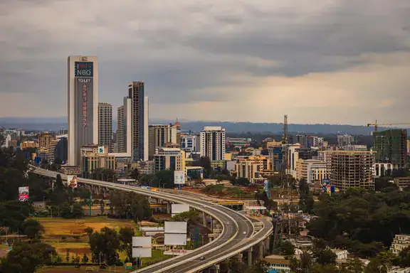 Nairobi central business district skyline and expressway — Pezari advises across Kenya's major markets